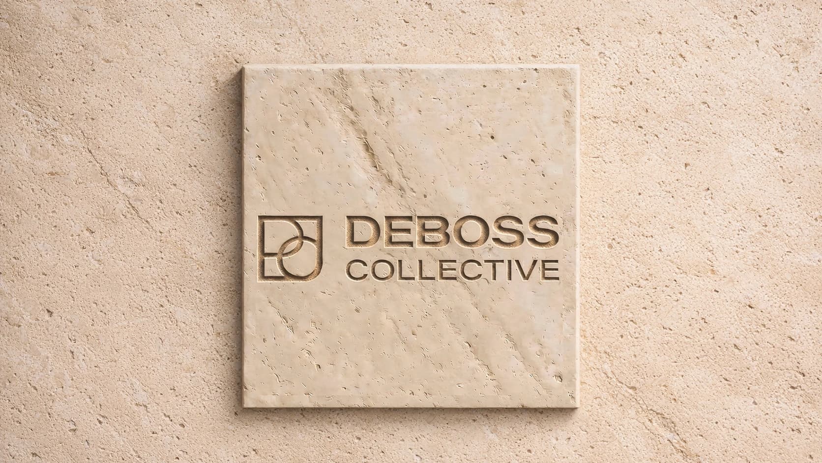 Deboss Collective logo debossed into a stone plaque.